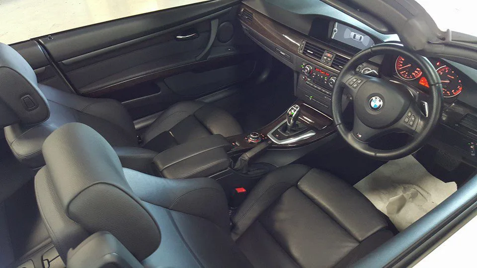 Black leather BMW cabin and dashboard after a Wurtzite interior coating at Ceramicar