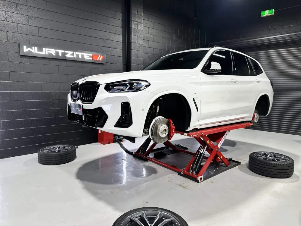 BMW X3 with wheels off for Wurtzite W750 wheel and caliper coating in Adelaide